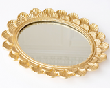 Elevate your living space with mirrored tray, a perfect blend of elegance &amp; functionality. It is expertly crafted from durable aluminum with a chic gold finish, adding a touch of sophistication to any room. Whether used as a centerpiece on your dining table or a stylish organizer for your favorite perfumes on your vanity, its reflective surface highlights your decor with a touch of glamour. Designed in the USA &amp; imported, the tray includes a convenient hook for hanging, allowing it to double as a wa