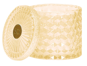 Decorative candle with textured design and 'Soy' logo on a white background