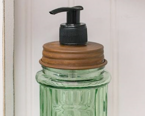 Green glass soap dispenser  This adorable embossed dispenser features with the word 