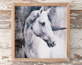 White stallion horse framed artwork

This white stallion artwork has a wood frame and has an MDF backing. This piece hangs with two saw-tooth hangers on the back.&nbsp;

Materials:
Wood

Dimensions:
14" wide x 1/2" deep x 14" high