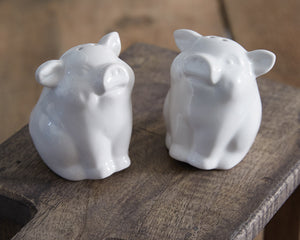 Give your dining table spices the playful abode that is in every farmhouse lover's dreams. Our piglet salt and pepper shakers bring a modern farmhouse touch to the table. They are made of ceramic and feature a rubber stopper. Please wash before use.  Materials: Ceramic  Dimensions: 2 1/4” wide x 2 1/2” deep x 3” high&nbsp;