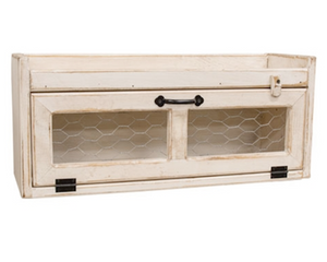 Antique white countertop box with chicken wire door

This countertop box is a versatile organization solution crafted with rustic farmhouse style. Made from wood with a distressed antique white painted finish, the box has a long horizontal storage compartment. The attached door features chicken wire panels, a metal handle, and a wooden frame, with a rotating clip that helps keep the door closed. A ledge around the top of the box makes it a great surface for decorative or functional displays.

This item is p