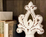 Decorative worn soft white ceramic finial pedestal