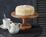 Feature homemade cupcakes, cheeses, and other delicious treats atop this lovely cake stand. Detailed with beautiful wood grain, this mango wood stand is handcrafted and features a turned wood base. Real wood is a product of nature, and as such, no two pieces are alike. Variations in grain, patterns, and color are to be expected and help create a beautiful and unique one-of-a-kind piece. This item is food safe.

Materials:
Mango wood

Dimensions:
6 1/4" high x 12" diameter

Care:
Hand-wash only