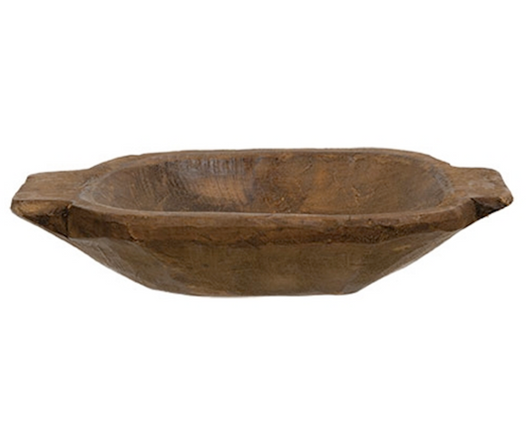 This decorative oval-shaped bowl is made of chunky, lightweight Spanish oak wood with a rough texture, natural dark brown finish, and flat paddled handles. This bowl makes a charming addition to everyday home decor, giving a rustic and handmade feel to any space. Line the bowl with a cloth napkin to serve rolls at supper. Display this bowl with potpourri, florals, greenery, or other filler, perfect for placing on a dining table, coffee table, or shelf. The possibilities are endless!