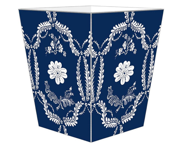 Navy blue & white floral wastebasket 

Enhance your space with our beautifully hand-painted wood wastepaper basket. Each basket is crafted with care, combining durability with stunning artistry, making them a perfect addition to any room. The artwork is hand-cut, decoupaged, and polished by a small team of artisans in Texas. Each wastepaper basket is carefully painted silver around the edges as the perfect finishing touch.

This item is proudly made in the USA.

Materials:
Wood

Dimensions:
9