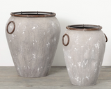 Outdoor rustic urn planter set

Change up your outdoor decor with this set of two rustic gray urn planters. Perfect for planting a variety of colors and textures, these attractive containers come with handles for easy movement and a drain hole and stopper in the bottom of each to help keep soil in place while watering. Bring life to any outdoor space with the beauty of these urn planters today!

Materials:
Metal, rubber, plastic

Dimensions:
Shorter planter -
14 1/2" deep x 14" wide x 18 3/4" high

Tallest 