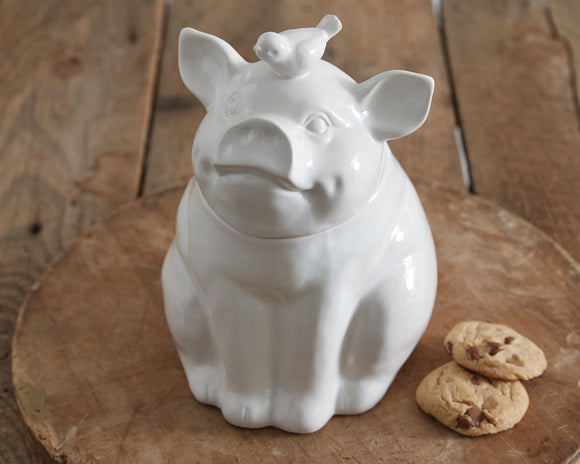 White ceramic piglet cookie jar