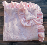 Luxurious baby pink blanket
*Made to order*

Made from high-quality Minky fabrics, which comprise luxuriously soft microfibers, this pink baby blanket features a matching satin ruffle trim. It is the perfect size for nap time cuddles. This blanket would be a great choice for a baby shower gift.

This item is proudly made in the USA.

Materials:
Minky fabrics

Dimensions:
30" wide x 30" high

Care:
These blankets should be washed on a gentle cycle by themselves, in cold water and mild non-chlorine soap. Do n