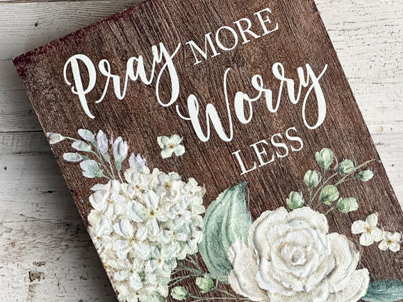 Wooden 'Pray More, Worry Less' shelf sitter

Add this lovely sign to a bookcase or desk for a daily inspirational reminder to trust in the Lord. The plaque reads, 