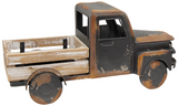 Capture the essence of vintage charm with this distressed black metal farm truck. Black painted metal with rusty distressing and a whitewashed wooden truck bed makes this timeless piece. It is perfect for a variety of settings, including shelves, mantels, and tabletops, adding a touch of vintage farmhouse style to any room. Fill it with seasonal faux florals or everyday greenery for a charming touch.

Materials:
Wood, metal

Dimensions:
8 3/4" high x 6" deep x 18" long