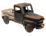 Capture the essence of vintage charm with this distressed black metal farm truck. Black painted metal with rusty distressing and a whitewashed wooden truck bed makes this timeless piece. It is perfect for a variety of settings, including shelves, mantels, and tabletops, adding a touch of vintage farmhouse style to any room. Fill it with seasonal faux florals or everyday greenery for a charming touch.

Materials:
Wood, metal

Dimensions:
8 3/4" high x 6" deep x 18" long