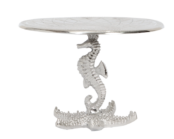 Decorative table with seahorse and alligator design on a white background