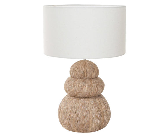 Add coastal charm to your beach house with this lovely lamp. It features a stacked sea urchin base in shades of sandy brown and comes with a neutral-toned fabric lamp shade. This is a great choice for a console table or guest room. <br>
