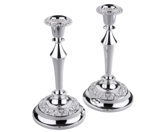 Set of 2 traditional Queen Anne candlesticks

Add traditional style to your dining table with these gorgeous candlesticks. Each candle holder features a rose design along the base and top. These candle holders are a great gift choice.

Materials:
Silver-plated metal

Dimensions:
4