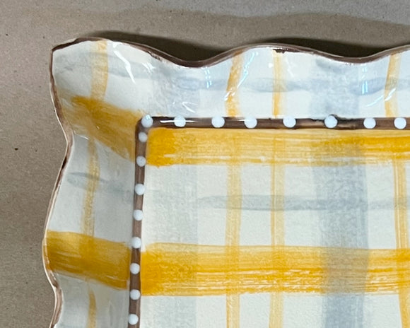 Handmade yellow buffalo check square platter

Function meets form with this lovely platter. Handmade in Mississippi, this square platter is made of stoneware, which is oven and dishwasher safe. It features a yellow and white plaid designed accented with neutral tones around the ruffled edges. This would be a great gift for newlyweds.

This item is proudly made in the USA.

Materials:
Stoneware

Dimensions:
11