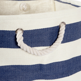 Close-up of a blue and white striped bag with rope handles.