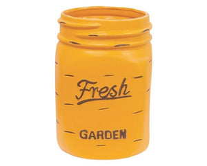  This planter is a painted enamel container that has a Ball mason jar design with a sunflower yellow finish that is contrasted by brown paint for a chipped and distressed look. The planter is embossed and reads, "Fresh Garden" in a brown finish. At more just over 1 foot high, it is perfect for displaying large florals or storing items like canes and umbrellas.  