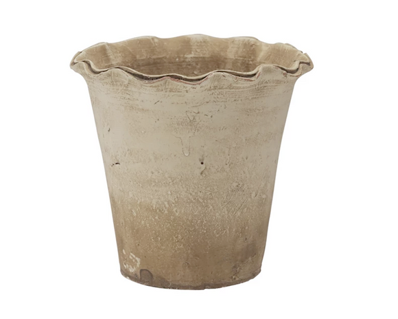 Terracotta pot with a textured surface on a white background
