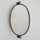 Vintage style oval wall mirror

Use this mirror in your bathroom to add some vintage charm. It is made out of metal and operates on a functioning swivel for multi-functional use. There are four screw holes for hanging. This is a great choice for a guest room.

Materials:
Metal, glass

Dimensions:
15 1/4" wide x 6 1/2" deep x 27 1/2 long overall