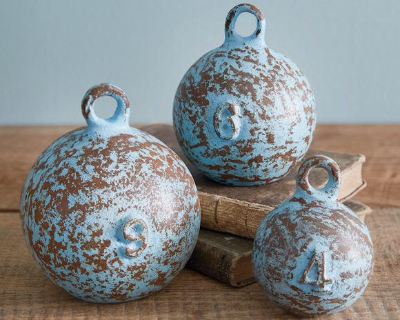 A fisherman's necessity, these maritime weights are the perfect addition to a nautical abode. Each is finished with a rustic blue finish giving them the weathered look from limitless voyages. Crafted from cast iron, these weights are durable replicas. <br>