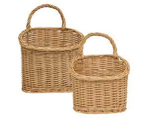 These baskets offer a charming accent for decorative displays. Made from woven willow with a natural light wood hue, the baskets feature a classic oval shape and single arched handle. They are perfect for displaying floral arrangements, decorative stakes, or other items.

Materials:
Willow

Dimensions:
Smaller basket -
8 1/4" wide x 4" deep x 10 1/2" high

Larger basket -
11 1/2" wide x 5 1/2" deep x 15 1/4" high