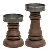 Walnut-stained wooden candle holders

These walnut-stained wood and metal candle holders look great with vintage farmhouse decor and are perfect holding our 3" diameter battery operated candles. The pair has a classic turned wood shape, while the mixed materials offer an on-trend appeal. These candle holders make for a great gift.

These candle holders hold up to a 3 1/4" diameter pillar candle.

Materials:
Wood, metal
