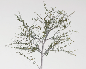 Artificial tree branch with leaves on a white background