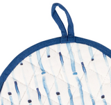 Quilted pot holder with blue and white pattern on a white background