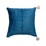Blue pillow with tassels on a white background