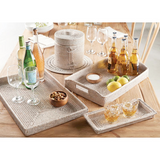 Woven trays on a table with drinks and snacks
