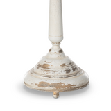 White candle holder with a distressed finish on a white background
