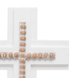 Decorative cross with wooden beads on a white background