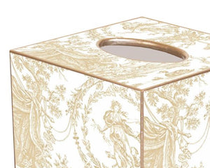 Traditional beige &amp; gold toile wooden tissue box cover

This beige toile decoupage tissue box cover is handmade to order by a wonderful team in Houston. They easily slide over any cubed tissue box cover. The artwork is hand-cut, decoupaged, and polished. Each tissue box cover is hand-painted in gold around the edges as the finishing touch.

This item is proudly made in the USA.

Materials:
Wood

Dimensions:
5" wide x 5" deep x 5 1/4" high