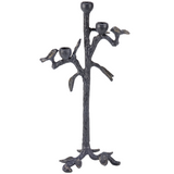 Decorative candle holder shaped like a tree with branches and birds on a white background