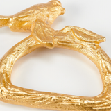 Gold bird napkin ring

This napkin ring features a gold color and sculpted bird on a branch on ring. It includes attached an gold ring with a sculpted branch design that easily slips over rolled napkin and, when not in use, can be added to table setting as a seasonal accent. This is a charming tabletop accessory perfect for seasonal gatherings.

Materials:
Metal

Dimensions:
3" diameter