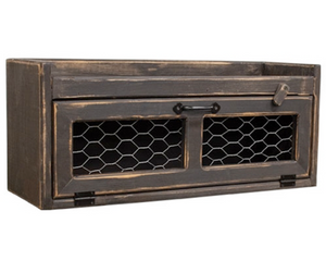 Distressed black countertop box with chicken wire door

This countertop box is a versatile organization solution crafted with rustic farmhouse style. Made from wood with a distressed black painted finish, the box has a long horizontal storage compartment. The attached door features chicken wire panels, a metal handle, and a wooden frame, with a rotating clip that helps keep the door closed. A ledge around the top of the box makes it a great surface for decorative or functional displays.

This item is proudl