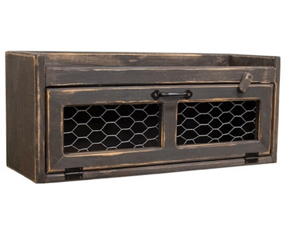 Distressed black countertop box with chicken wire door

This countertop box is a versatile organization solution crafted with rustic farmhouse style. Made from wood with a distressed black painted finish, the box has a long horizontal storage compartment. The attached door features chicken wire panels, a metal handle, and a wooden frame, with a rotating clip that helps keep the door closed. A ledge around the top of the box makes it a great surface for decorative or functional displays.

This item is proudl