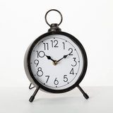 Vintage style round black metal desk clock

Step back in time with this antique-inspired black metal desk clock. Featuring bold numbers, wood accents, and a handle that resembles the olden days, this time keeper will help you stay on task and on schedule.

Materials:
Metal

Dimensions:
6 1/2" wide x 2" deep x 9 1/2" tall