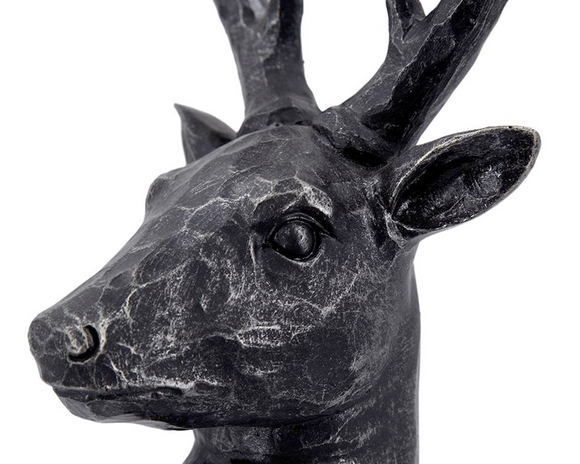 Black deer head sculpture on a white background