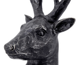 Black deer head sculpture on a white background
