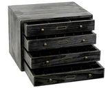 Stack of black wooden drawers with brass handles on a white background