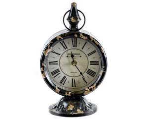 Decorative clock with black and gold tan design on a white background