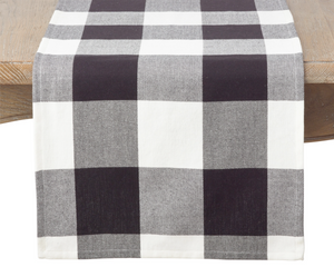 Country farmhouse buffalo check table runner

Made from 100% cotton, this black and white buffalo plaid table runner is a perfect addition to your dining area. Turn your dining, kitchen, or sofa table into an exhibition with this perfect mix of traditional and modern styles.&nbsp;

Materials:
Cotton

Dimensions:
16" wide
72" to 108" long overall

Care:&nbsp;
Machine washable