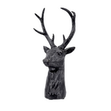 Black deer head statue on a white background