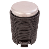 Cylindrical object with a metallic top and textured black base on a white background