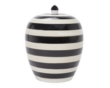 Black and white striped ceramic jar on a white background