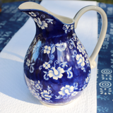 Royal blue floral garden stoneware pitcher

Elegant and sophisticated, this pretty pitcher is lovingly painted by hand with every attention paid to detail and quality. While playing on classic sensibilities of blue and white innate to Chinese ceramics, this pitcher brings the trend into the modern era with its scalloped sturdy stoneware body and playful floral pattern.

Materials:
Stoneware

Dimensions:
8 3/4" wide x 7 1/4" deep x 10" high

Care:
Hand-wash only