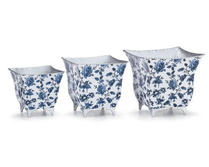 Set of 3 blue flower planters

This nested planter assortment with a blue floral pattern around the sides would look beautiful filled with ferns in a sun room. Each planter has decorative feet and rope detail around the rims. These planters are a lovely choice for a wedding gift.

Materials:
Metal

Dimensions:
Smallest planter -
5 1/2" wide x 5 1/2" deep x 5 1/2" high

Medium-sized planter -
6 1/2" wide x 6 1/2" deep x 6 1/2" high

Largest planter -
7 3/4" wide x 7 3/4" deep x 7 1/2" high