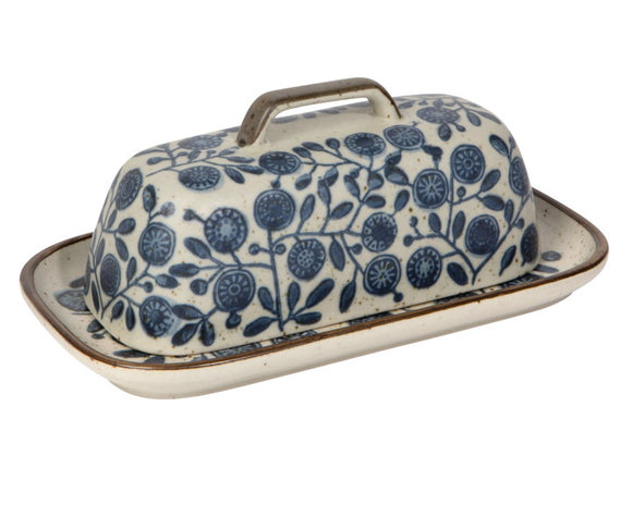 Butter dish with blue floral pattern on a white background